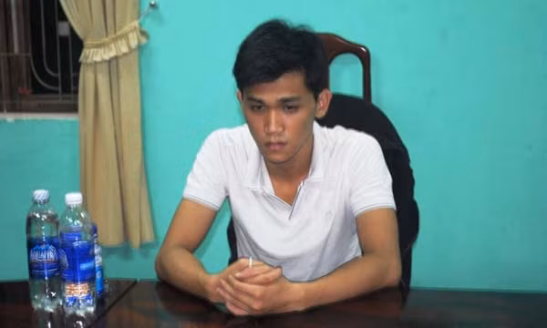 Nguyễn Hữu Quang tại cơ quan công an.