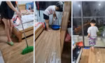 Mưa bão lớn, dân chung cư ở Hà Nội hì hục ‘tát nước’ khỏi nhà