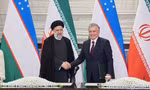 Tổng thống Uzbekistan Shavkat Mirziyoyev (phải) gặp người đồng cấp Iran Ebrahim Raisi trước thượng đỉnh SCO ngày 14/9. (Ảnh: Reuters) 