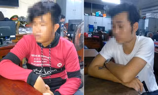 Nguyễn Đức Nhân (áo đỏ) và Lê Thanh H (áo trắng) tại cơ quan Công an.