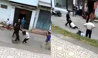 Cô gái bị túm tóc, kéo lê dưới đường. Ảnh cắt từ clip