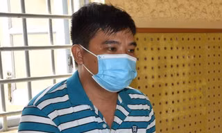 Lê Văn Tiểu tại cơ quan công an.