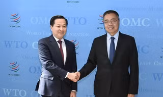 Phó Thủ tướng Lê Minh Khái và Phó Tổng giám đốc WTO Trương Hướng Thần. (Ảnh: BNG)