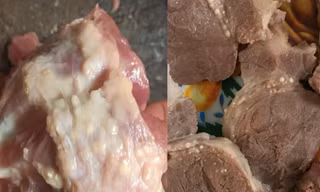Thịt lợn nổi đầy hạch trắng được phát hiện trong bếp ăn trường Mầm non Thanh Khương. Ảnh: Phụ huynh cung cấp 