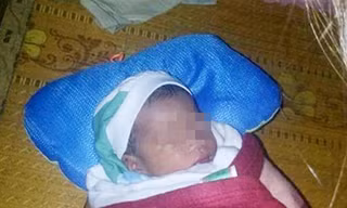 Bé trai sơ sinh bị bỏ rơi khi bão chuẩn bị đổ bộ