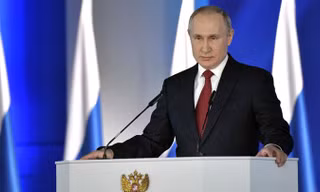 Tổng thống Nga Vladimir Putin đọc thông điệp Liên bang ngày 21/2. (Ảnh: Sputnik)