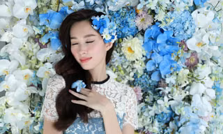 Hoa hậu Thu Thảo xinh đẹp với váy kết hàng trăm hoa lan
