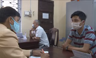 Lê Nguyên Thanh Bình tại cơ quan công an.