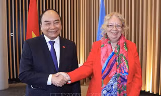 Chủ tịch nước Nguyễn Xuân Phúc gặp Tổng Giám đốc Văn phòng LHQ Tatiana Valoya. (Ảnh: TTXVN)