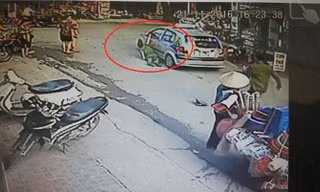 Taxi đóng cửa kính kẹp tay cảnh sát rồi kéo lê trên đường