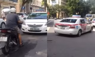 Chạy ngược chiều, taxi bị SH ép đi lùi hàng chục mét