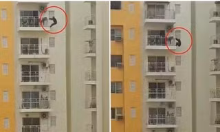 Một người Ấn Độ tập thể dục bằng cách đu bên ngoài ban-công tầng 12, ai nhìn cũng hoảng