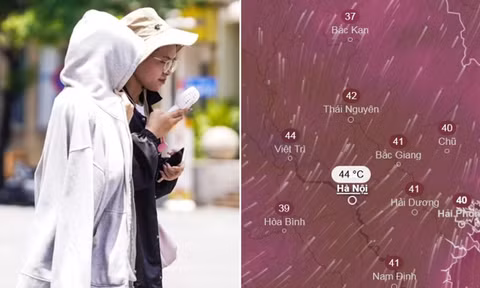 Người dân che nắng khi di chuyển ngoài trời ở Hà Nội