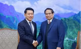Thủ tướng Phạm Minh Chính tiếp Phó Thủ tướng Lào Saleumxay Kommasith. (Ảnh: VGP)