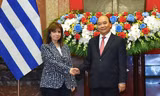 Chủ tịch nước Nguyễn Xuân Phúc đón Tổng thống Hy Lạp Katerina Sakellaropoulou ngày 16/5. (Ảnh: Anh Sơn) 