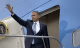 Tổng thống Obama trên chuyên cơ Air Force One. Ảnh: AFP.