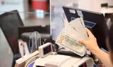 Giá USD trên thị trường tự do đã vượt mức 26.000 đồng. Ảnh: Như Ý