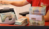 Nhiều chi nhánh chưa cho khách hàng vay ngân hàng này trả nợ ngân hàng khác. Ảnh: Như Ý