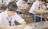 Thí sinh làm bài thi tốt nghiệp THPT 2014 ở TPHCM. Ảnh: Nguyễn Dũng