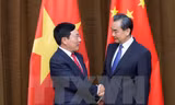 Phó Thủ tướng , Bộ trưởng Ngoại giao Phạm Bình Minh (trái) và Bộ truởng Ngoại giao Trung Quốc Vương Nghị (phải) tại cuộc gặp ở Bắc Kinh, Trung Quốc ngày 18/4. (Nguồn: THX/TTXVN)