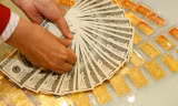 Giá vàng đồng loạt giảm, tỷ giá USD hạ nhiệt 