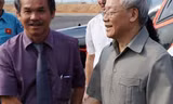 Chủ tịch Tập đoàn HAGL đón Tổng bí thư Nguyễn Phú Trọng sang thăm và động viên các nhà đầu tư Việt Nam vào Lào tại Attapeu, ngày 12.4.2014
