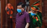 Ông Đinh La Thăng tại phiên tòa sơ thẩm. Ảnh: Tân Châu