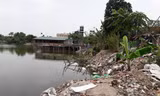 Ngang nhiên xây nhà trái phép trên hồ sen Đầm Trị