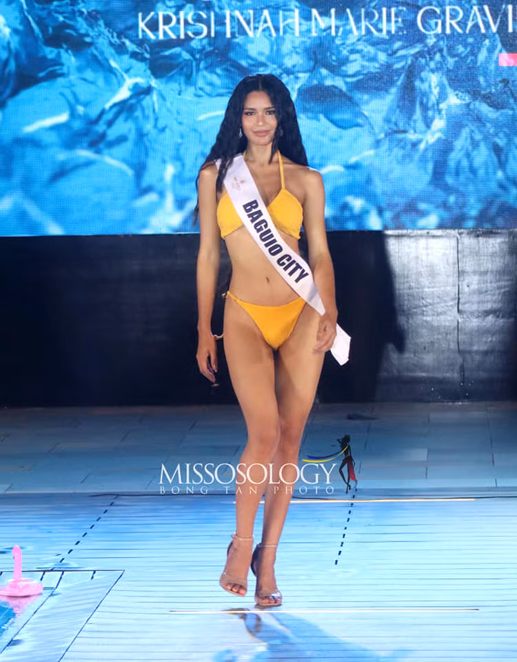 Krishnah Gravidez năm nay 23 tuổi, là sinh viên chuyên ngành xây dựng kỹ thuật dân dụng. Cô từng tham dự cuộc thi Hoa hậu Hoàn vũ Philippines 2023 và là một trong những ứng viên nhận được sự yêu mến của công chúng. Người đẹp có hình thể quyến rũ, kỹ năng catwalk chuyên nghiệp.