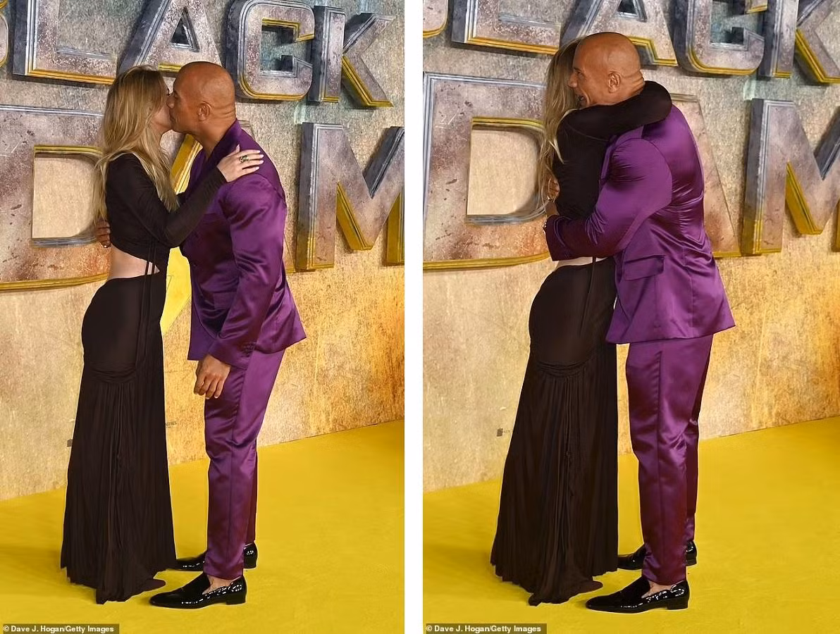 Dwayne Johnson ôm hôn nữ đồng nghiệp trên thảm đỏ. Ảnh: Getty Images.