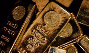 Giá vàng tăng nhẹ, USD đảo chiều 